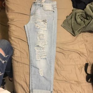 Lightwashed blue Capri boyfriend cut ripped jeans